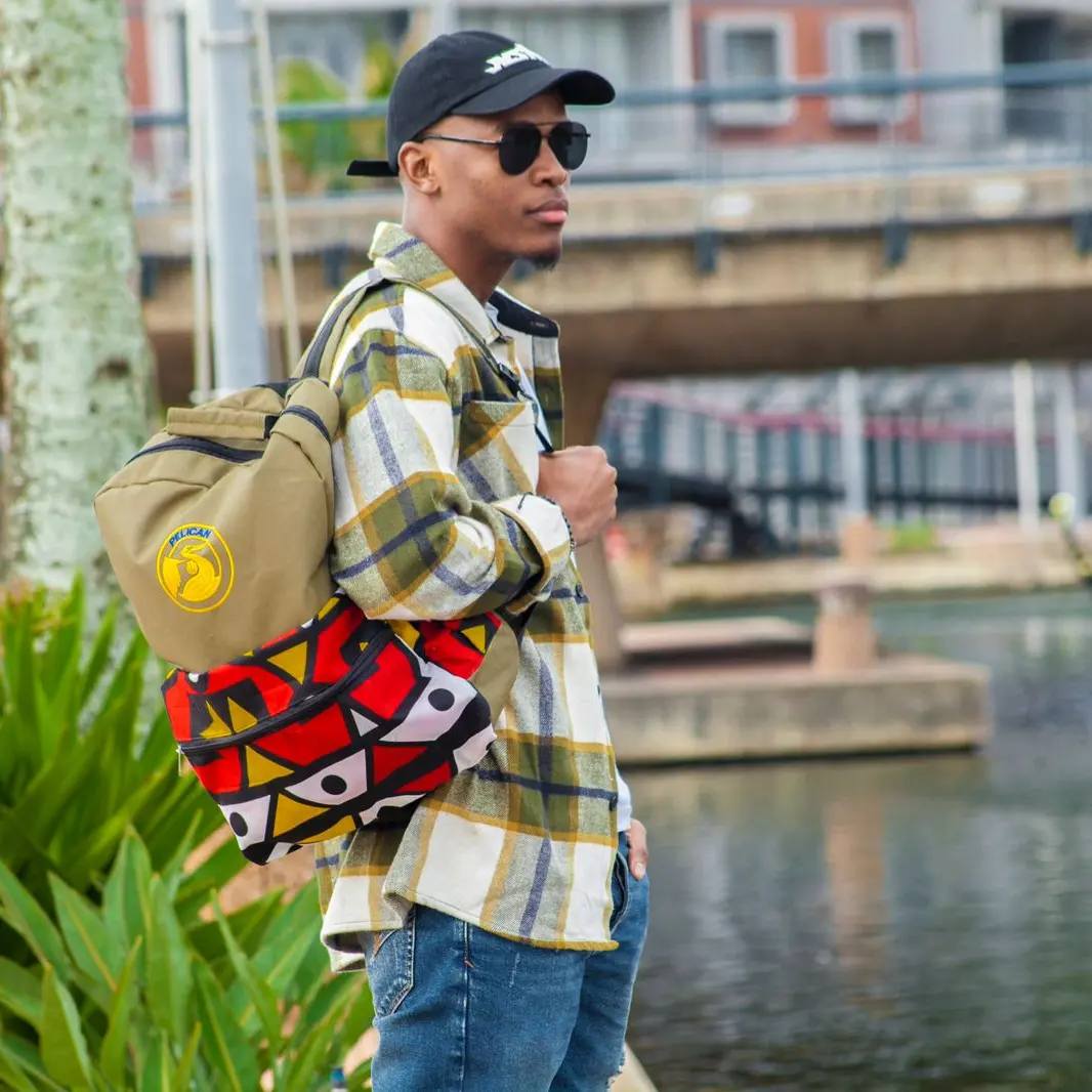 Young man with Pelican bag in urban South African setting